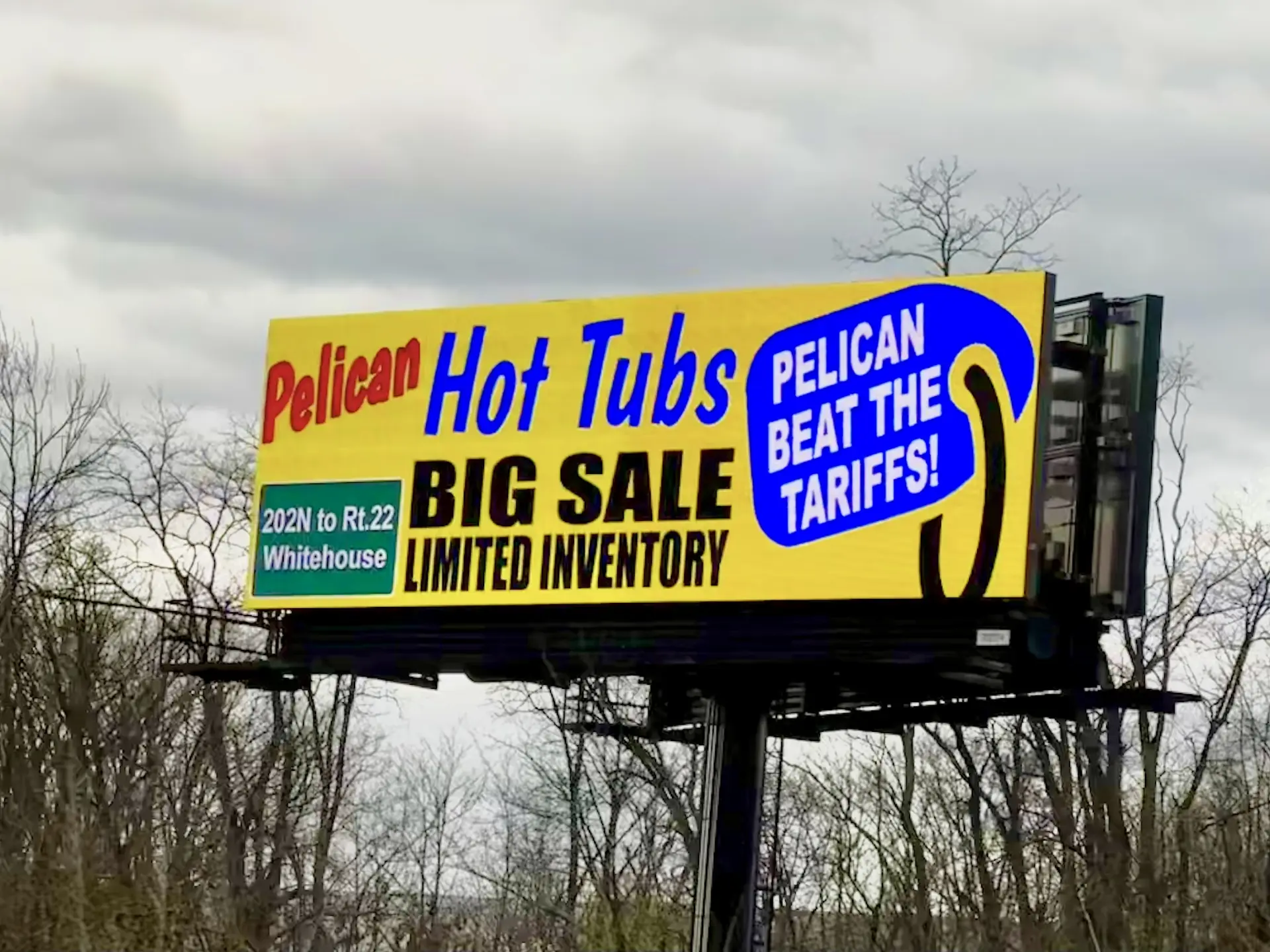Pelican Hot Tubs billboard advertisement on a roadside structure