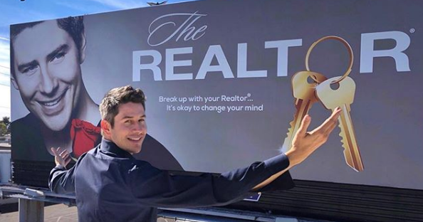 Realtor billboard creative with a person holding oversized keys